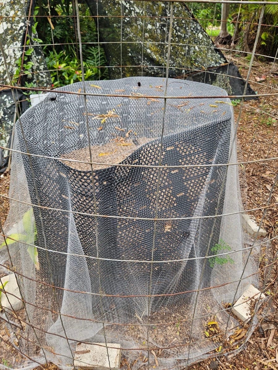 Photo of netted compost pile